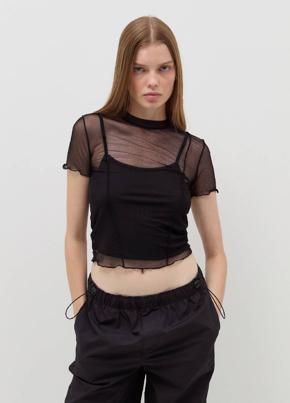B. ANGEL T-shirt crop in mesh con profili ondulati Negozio